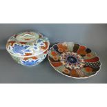 A 20th century Imari charger and a Oriental pot and cover both early with 32cm diameter Condition