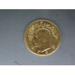 An Iranian gold coin, 1/2 Pahlavi approx weight 4 grams .