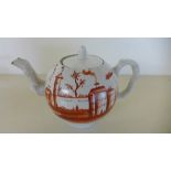 An 18th century creamware globular teapot with knarled handle and spout with rust red landscape