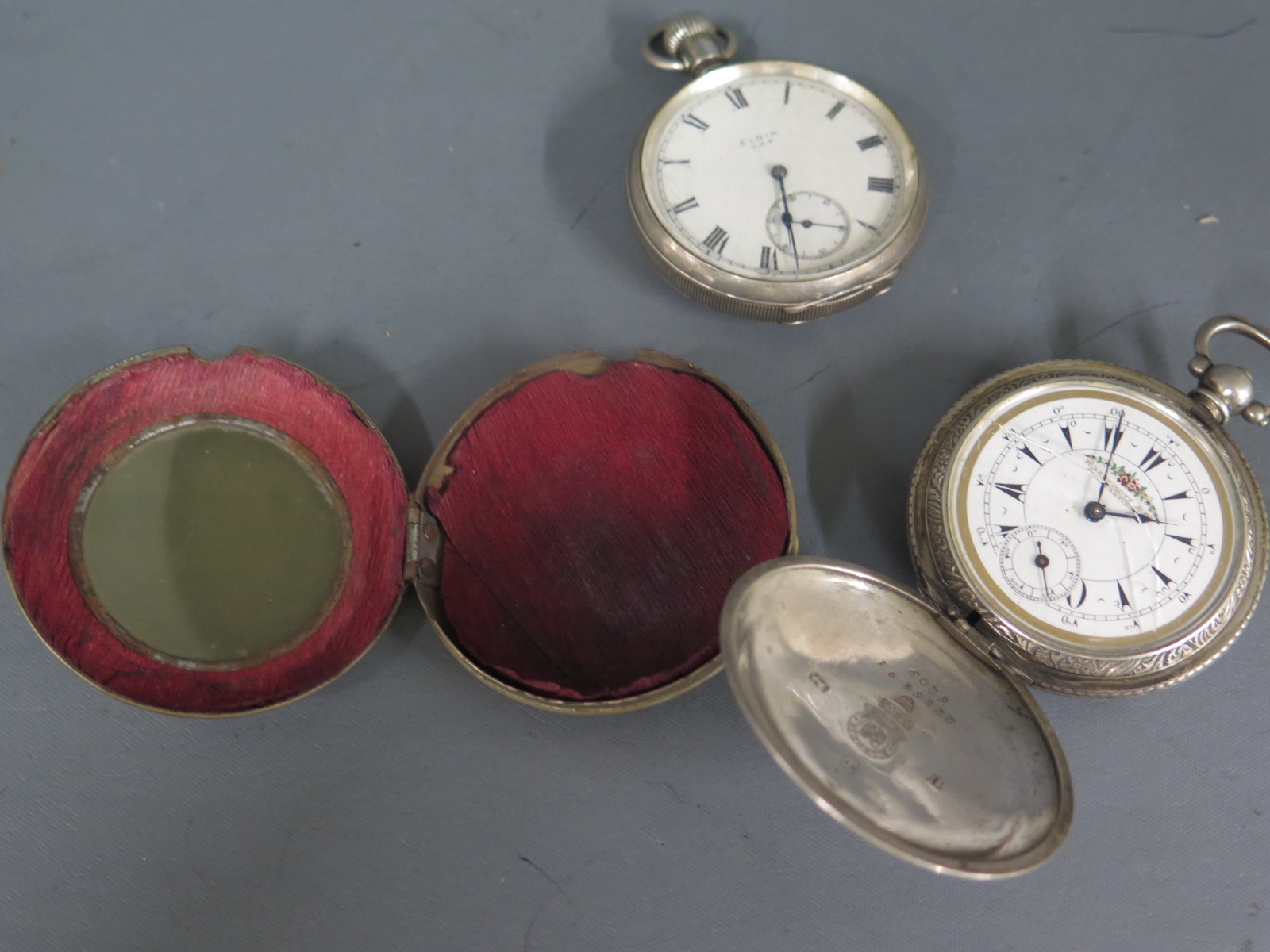 A silver pocket watch by Elgin and a Continental silver 800 pocket watch - both in need of some