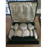 A Walker and Hall six piece silver backed dressing table set in original box generally good some