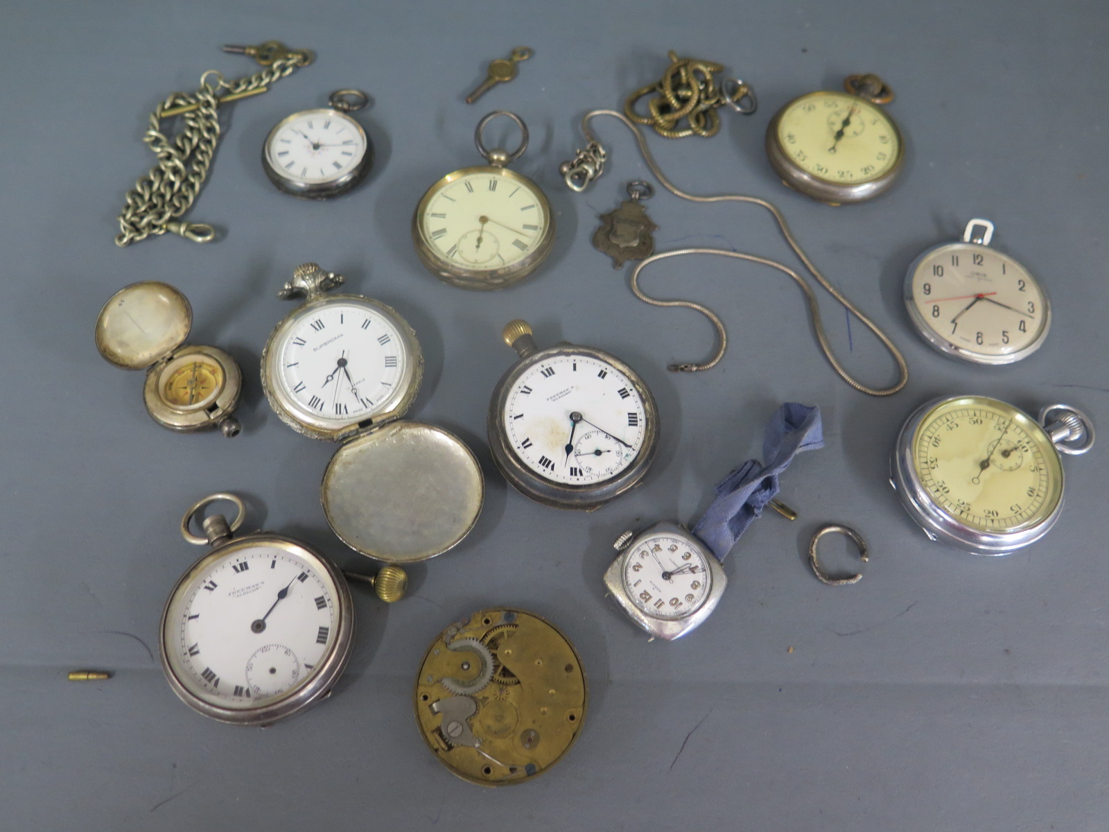 A collection of 9 assorted watches and a compass with chains and keys - all needing attention