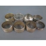 Eight Napkin rings of differing design and dates, five with hallmarks,