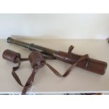 A brass two drawer leather cased telescope - generally good,