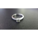 A platinum LEO diamond ring - Accompanied by an IGI report stating the diamond as LEO 048459, 0.