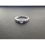 A 14ct gold cubic zirconia tension-set ring - Hallmarked Birmingham - Ring size T - Weight approx 2.