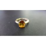 A 9ct gold citrine single-stone ring - Hallmarked Birmingham - Ring size O - Weight approx 2.