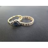 A sapphire and diamond three-stone crossover ring - Stamped 18ct and plat - Ring size M - Weight