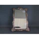 A silver embossed mirror maker RC - 37cm x 24cm - overall good condition