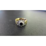 A 9ct gold sapphire and diamond cluster ring - Hallmarked London - Ring size M - Weight approx 2.