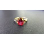 A 9ct gold red topaz single-stone ring - Hallmarked Birmingham - Ring size S 1/2 - Weight approx 3.