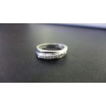 A 9ct gold diamond band ring - Hallmarked London - Ring size M - Weight approx 2.