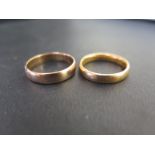 Two 22ct gold band rings - Hallmarked Birmingham - Ring sizes Q and R 1/2 - Total weight approx 11.