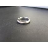 A white band ring - Stamped 18ct - Ring size M - Weight approx 4.