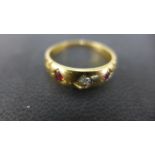 An 18ct ruby and diamond ring - Size Q - Weight approx. 4.