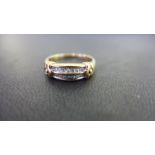 A 9ct gold diamond two-row band ring - Partial hallmark - Ring size R - Weight approx 3.