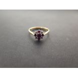 A ruby and diamond cluster ring - Stamped 18ct and plat - Ring size L - Weight approx 2.