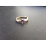 An amethyst single-stone ring - Hallmarked Birmingham - Ring size R - Weight approx 2.