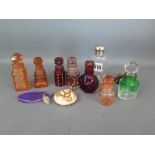 A collection of eleven scent bottles including a ceramic oriental style bottle with a silver top