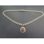 A 9ct gold fancy-link chain - Suspending an amethyst pendant - Hallmarked Sheffield - Length of