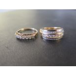 Two cubic zirconia dress rings - Both with marks indicating 9ct gold - Ring sizes L and M - Weight