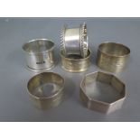 Six silver napkin rings - varying condition - approx weight 3.