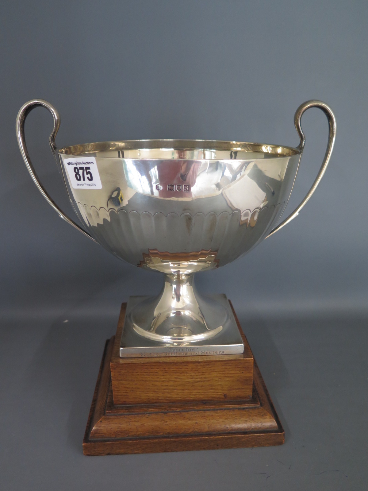 A silver presentation twin handled bowl on wooden stand London 1913/14 TB&S - Height 23cm approx