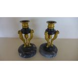 A pair of ormolu and bronze triform candle sticks on marble bases - Height 15cm - chips to marble