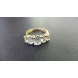 A 9ct gold aquamarine five-stone ring - Hallmarked Birmingham - Ring size N - Weight approx 2.