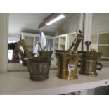 Three bronze pestle and mortars