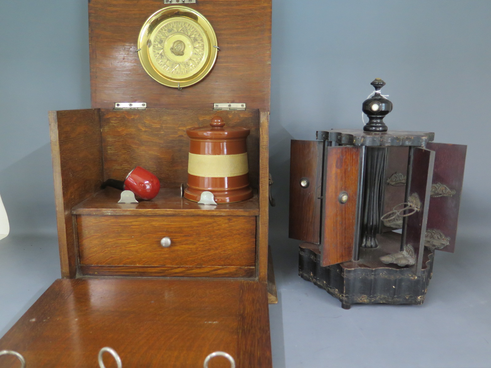 A cigar companion with six doors operating from centre spindle each hold three cigars and a smokers