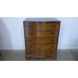 A 20th century walnut serpentine five drawer chest