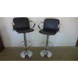 A pair of chrome kitchen stools