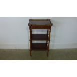 A 20th century inlaid French three tier whatnot with frieze drawer and brass gallery