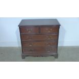 A 20th century mahogany inlaid chest of two over three drawers