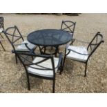A Bramblecrest mesh table and four chairs