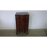 A 20th century Bevan Funnell reprodux serpentine five drawer chest