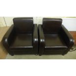 A pair of leather armchairs in good condition