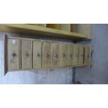 A painted shabby chic Wellington style chest with 10 small drawers - Height 137cm x Width 41cm x