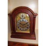 An eight day three train bracket clock with brass movement stamped Gustav Becker with chime and