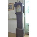 A good quality musical eight day longcase clock in an carved oak case with a 12" moon roller