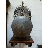 An 18th century style brass hook and spike lantern wall clock - the 17cm diameter signed Thos Moore,