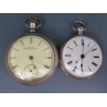 Two white metal cased open faced pocket watches both with Roman numerals to chapter rings,