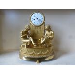 A good quality 19th century bronze gilded library clock with two girls seated before a bookcase