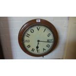 An oak cased advertising wall clock with a painted 12 inch dial HOVIS BREAD SOLD HERE movement