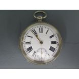 A white metal cased open faced pocket watch with white enamel dial,