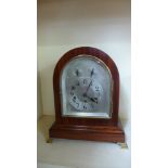 A Junghams mahogany chiming mantel clock,