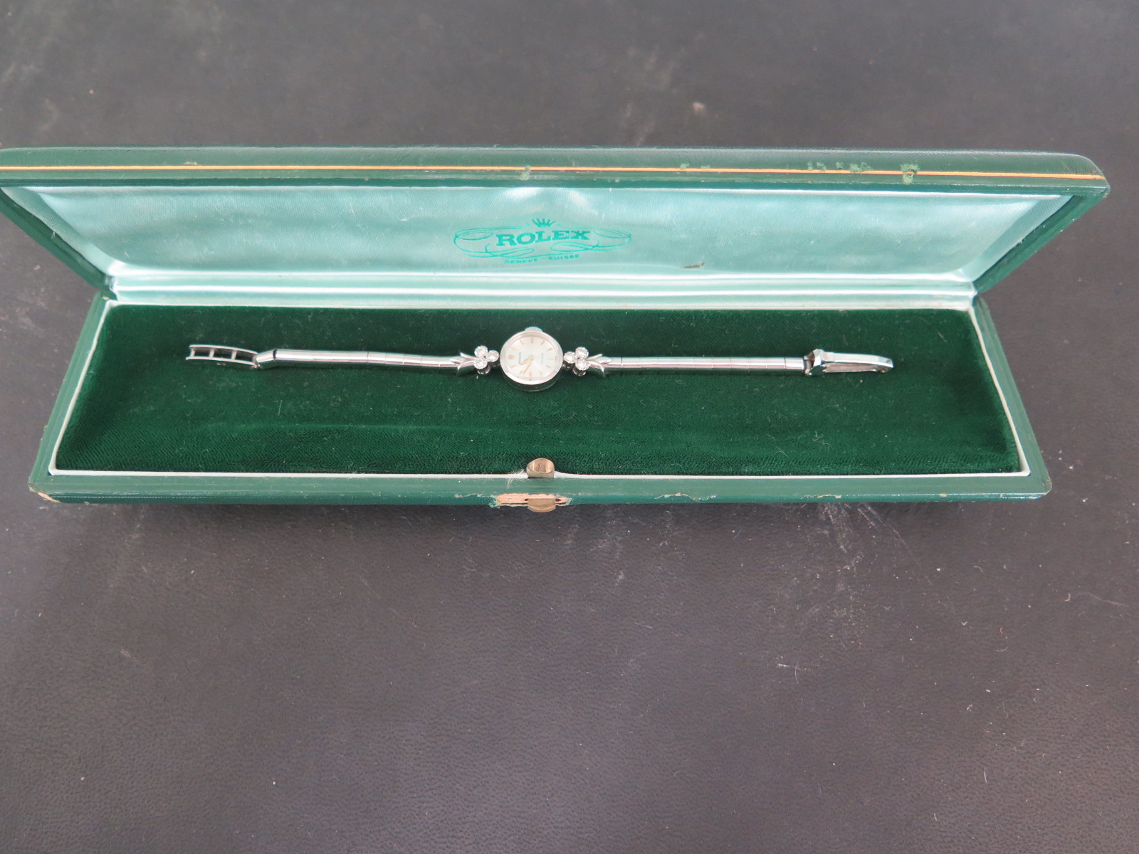 An early 20th century white gold Ladies Rolex bracelet wristwatch set with three diamonds to each
