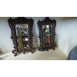 A pair of brass wall mirrors with beveled edge glass - 47cm x 28cm Condition report: One piece