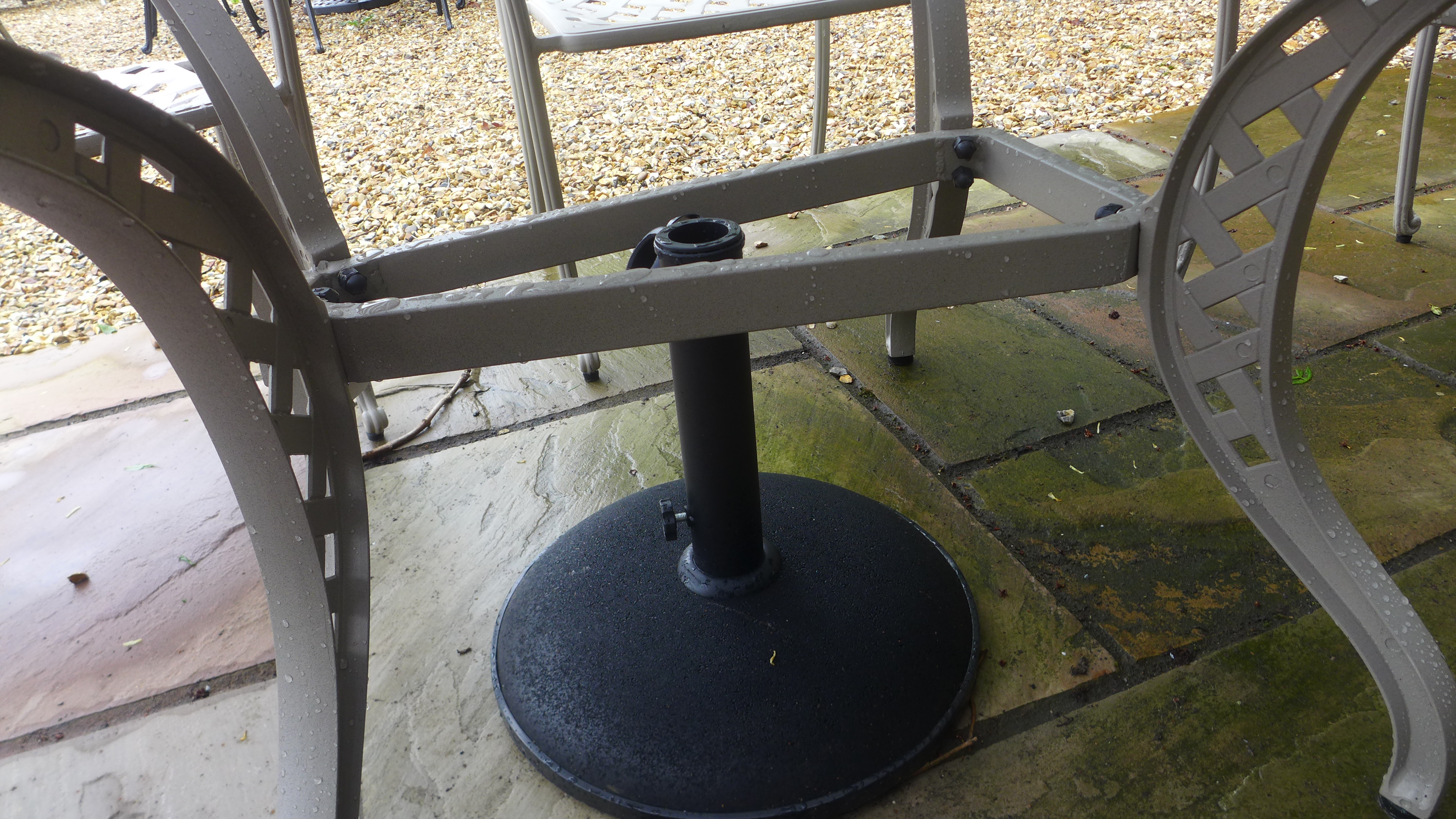 A Bramblecrest Roma stone table and 6 chairs - damage to one chair and the undertier table base - Image 2 of 2